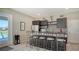 Wet bar with granite countertops and seating for four at 7616 Alumni Trl, Sarasota, FL 34243