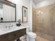 Modern bathroom with a floating vanity and glass shower at 8325 Lindrick Ln, Bradenton, FL 34202