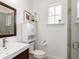 Small bathroom with shower, toilet and single vanity at 8325 Lindrick Ln, Bradenton, FL 34202