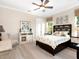 Bright bedroom with a king-size bed and large windows at 8325 Lindrick Ln, Bradenton, FL 34202