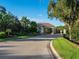 Gated community entrance with lush landscaping and signage at 8325 Lindrick Ln, Bradenton, FL 34202