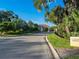 Gated community entrance with lush landscaping and signage at 8325 Lindrick Ln, Bradenton, FL 34202