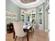Bright dining room with large windows and elegant chandelier at 8325 Lindrick Ln, Bradenton, FL 34202