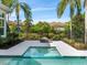 Relaxing firepit and spa nestled in a tropical setting at 8325 Lindrick Ln, Bradenton, FL 34202