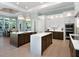 Gourmet kitchen boasts two islands, stainless steel appliances, and ample cabinetry at 8325 Lindrick Ln, Bradenton, FL 34202