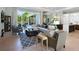 Open and bright living area with hardwood floors, large windows, and comfortable seating at 8325 Lindrick Ln, Bradenton, FL 34202