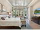 Luxurious main bedroom with ample natural light and sitting area at 8325 Lindrick Ln, Bradenton, FL 34202
