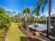 Private pool area with black metal fence and lush landscaping at 8325 Lindrick Ln, Bradenton, FL 34202