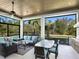 Relaxing screened patio with seating area, outdoor kitchen, and pool view at 8325 Lindrick Ln, Bradenton, FL 34202
