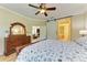 Serene bedroom featuring a king bed, barn door to en-suite, and built-in dresser at 1230 Collier Pl, Venice, FL 34293