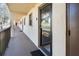 Condo hallway with access to individual condo units at 104 Capri Isles Blvd # 207, Venice, FL 34292