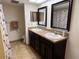 Updated bathroom with double sinks, shower, and tiled floors at 1111 Faith W Cir # 2003, Bradenton, FL 34212