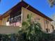 Building exterior showcasing a balcony and tropical plants at 1111 Faith W Cir # 2003, Bradenton, FL 34212