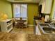 Kitchen with breakfast nook and view to outside at 1111 Faith W Cir # 2003, Bradenton, FL 34212