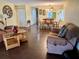Bright living room with dining area, hardwood floors, and ample natural light at 1111 Faith W Cir # 2003, Bradenton, FL 34212