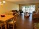 Living room with dark laminate floors and comfy furniture at 1111 Faith W Cir # 2003, Bradenton, FL 34212