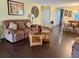Spacious living room with hardwood floors and a view into the dining area at 1111 Faith W Cir # 2003, Bradenton, FL 34212