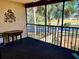 Screened balcony overlooking a lush green landscape at 1111 Faith W Cir # 2003, Bradenton, FL 34212