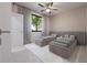 Bright bedroom with two twin beds, ceiling fan, and window at 12198 Terkelsen Ave, Port Charlotte, FL 33981