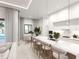 Modern kitchen with white cabinets and marble island at 12198 Terkelsen Ave, Port Charlotte, FL 33981