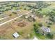 Aerial view of property showing home, garden, and surrounding land at 14900 Coker Gully Rd, Myakka City, FL 34251