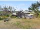 Farmhouse on a large lot with mature trees and open space at 14900 Coker Gully Rd, Myakka City, FL 34251