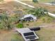 Aerial view of farmhouse, garden, and outbuildings at 14900 Coker Gully Rd, Myakka City, FL 34251