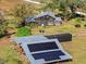 Aerial view of home with solar panels and large property at 14900 Coker Gully Rd, Myakka City, FL 34251