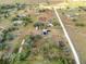 Aerial view showing a rural property with buildings and a large garden at 14900 Coker Gully Rd, Myakka City, FL 34251
