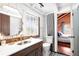 Modern bathroom with marble vanity and black and white floor at 14900 Coker Gully Rd, Myakka City, FL 34251