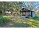 Charming rustic cabin nestled in a spacious backyard setting at 14900 Coker Gully Rd, Myakka City, FL 34251