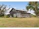 Rustic black barn home with large screened porch and expansive yard at 14900 Coker Gully Rd, Myakka City, FL 34251