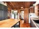Modern kitchen with butcher block island, dark cabinetry, and wood floors at 14900 Coker Gully Rd, Myakka City, FL 34251