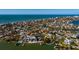 Aerial view highlighting a home's prime waterfront location with water access at 15815 Redington Dr, Redington Beach, FL 33708