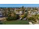 Aerial view of waterfront home with private dock and lush landscaping at 15815 Redington Dr, Redington Beach, FL 33708