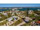 Aerial view of waterfront property with expansive water views and lush landscaping at 15815 Redington Dr, Redington Beach, FL 33708