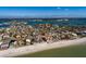 Aerial view of beachfront property, showcasing a luxurious home near the ocean at 15815 Redington Dr, Redington Beach, FL 33708