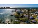 Aerial view of a waterfront home with private dock and access to the water at 15815 Redington Dr, Redington Beach, FL 33708