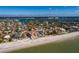 Beachfront property aerial view, showcasing a luxurious home with ocean views at 15815 Redington Dr, Redington Beach, FL 33708