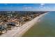 Beachfront home aerial view, showcasing a luxurious home near the ocean at 15815 Redington Dr, Redington Beach, FL 33708