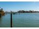 Calm waterfront view with a bird perched on a post at 15815 Redington Dr, Redington Beach, FL 33708