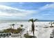 Aerial view showcasing beach, ocean, and palm trees at 19 Whispering Sands Dr # 301, Sarasota, FL 34242