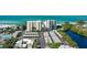 Beautiful aerial view of two condominium buildings and a white sand beach on the Gulf of Mexico at 19 Whispering Sands Dr # 301, Sarasota, FL 34242