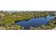 Aerial view of waterfront property with lush vegetation at 19 Whispering Sands Dr # 301, Sarasota, FL 34242