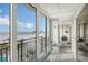 Balcony with beach views, chairs and access to the interior of the property at 19 Whispering Sands Dr # 301, Sarasota, FL 34242
