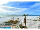 Expansive view of beach, ocean, and resort pool at 19 Whispering Sands Dr # 301, Sarasota, FL 34242