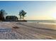 Peaceful beach view with home in background at 19 Whispering Sands Dr # 301, Sarasota, FL 34242
