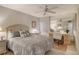 Bedroom with queen-size bed and workspace at 19 Whispering Sands Dr # 301, Sarasota, FL 34242