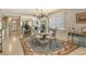 Dining room featuring a glass table, seating for six, a chandelier and mirrored wall at 19 Whispering Sands Dr # 301, Sarasota, FL 34242