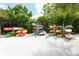 Kayaks are stored on individual racks in a sandy area at 19 Whispering Sands Dr # 301, Sarasota, FL 34242